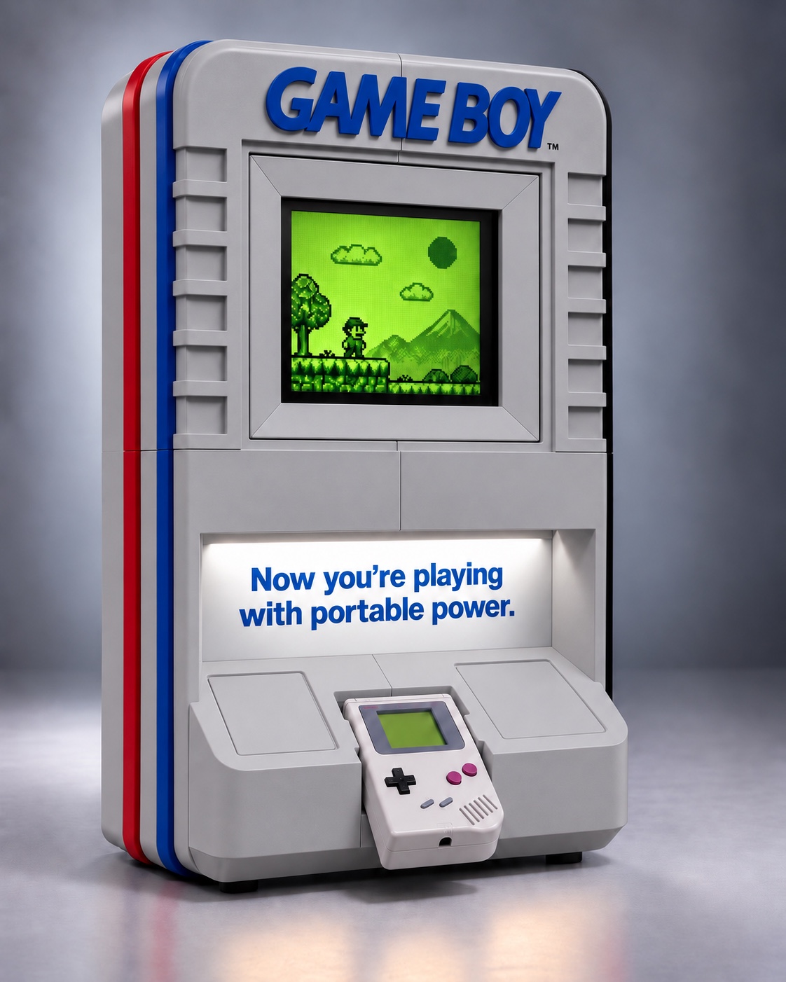 Gray Game Boy-inspired kiosk with blue lettering, red and blue side stripes, a green upper display, and an original-style Game Boy on the lower shelf.